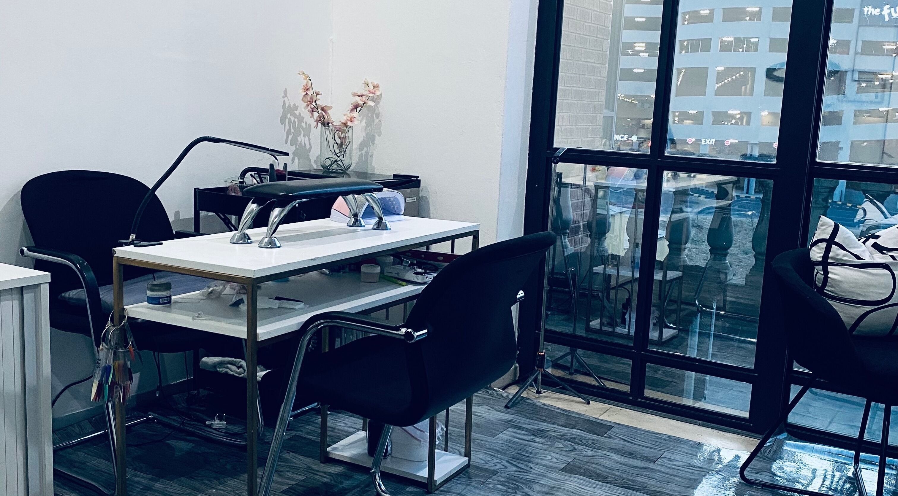 Chic nail station at Blackdime Beauty Bar in Johannesburg, Gauteng, ZA, with modern decor and natural light.