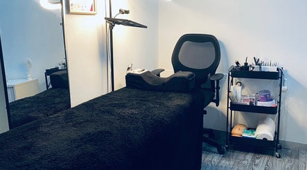 Cozy treatment room at Blackdime Beauty Bar, Johannesburg, Gauteng, ZA with a plush bed and beauty tools.