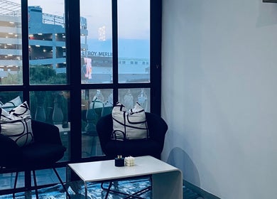 Chic lounge area at Blackdime Beauty Bar, Johannesburg, Gauteng, ZA with modern decor and ample window light.