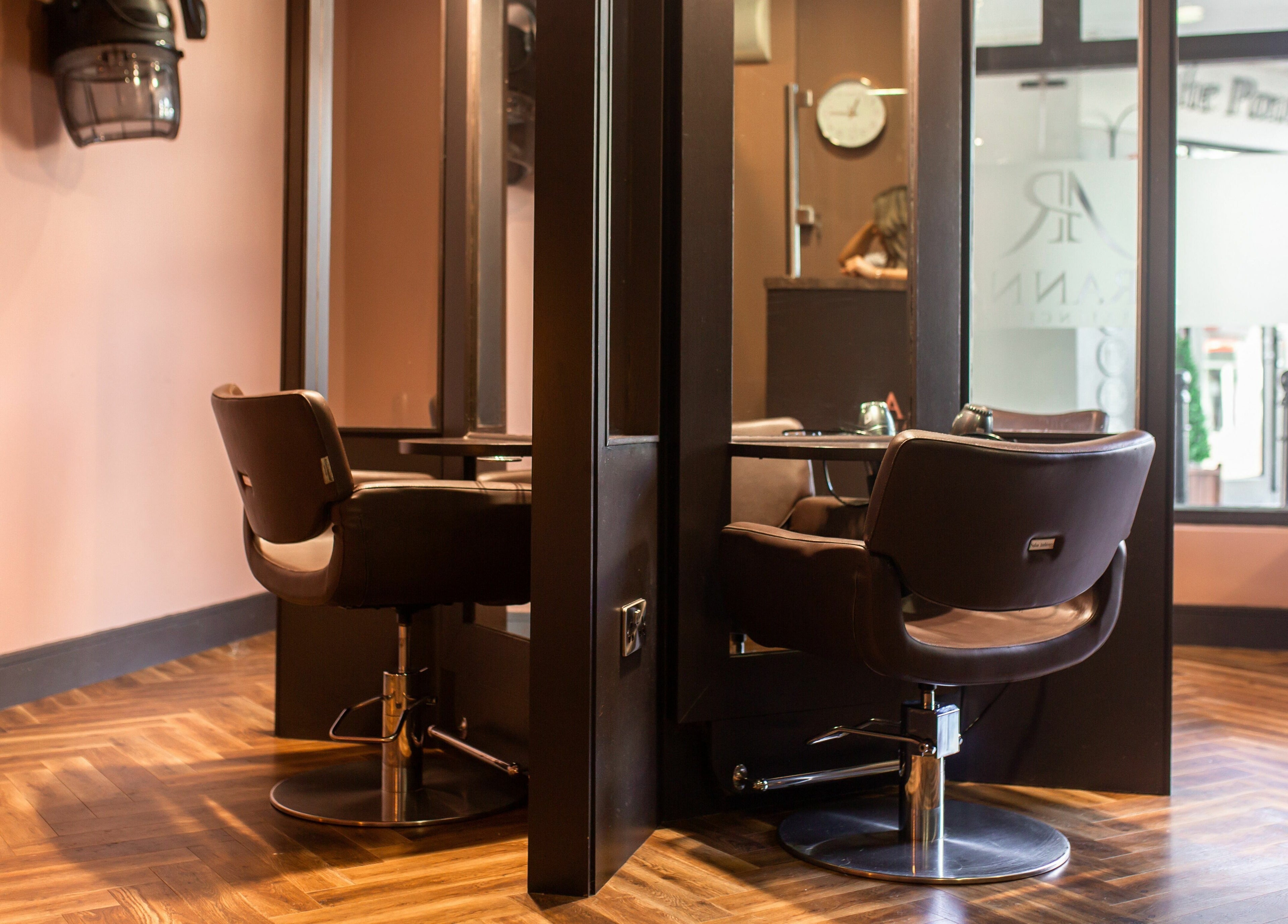 Elegant salon station at Aranna, County Tipperary, IE with chic chairs and wooden flooring.