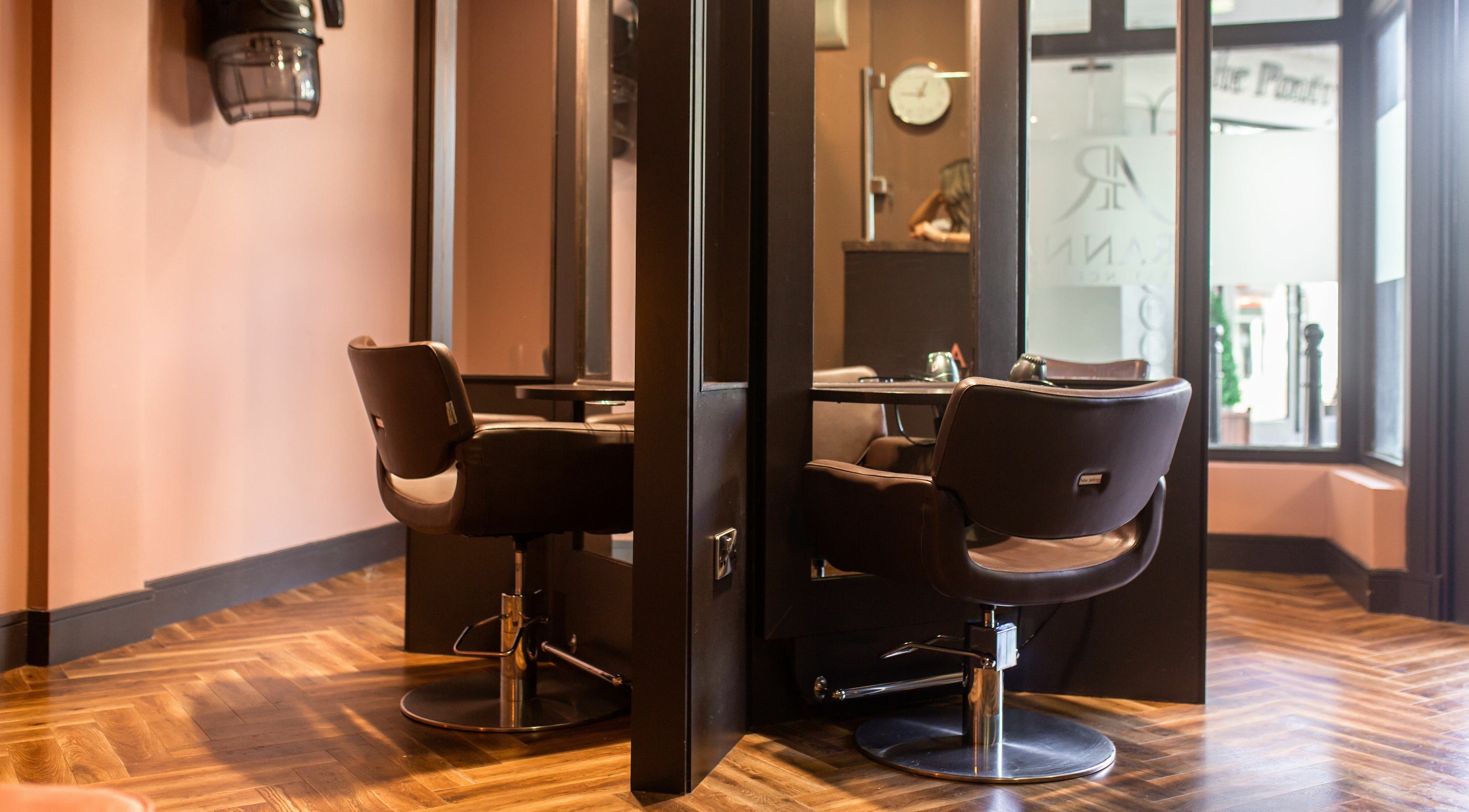 Elegant salon station at Aranna, County Tipperary, IE with chic chairs and wooden flooring.