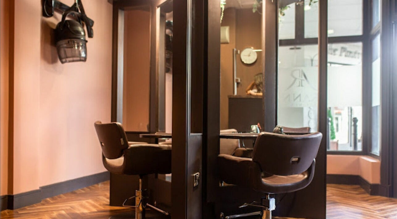 Modern salon interior at Aranna at Core, Templemore, County Tipperary, IE with stylish chairs and mirrors.