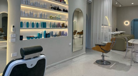 Elegant salon setup at RM The Studio, Melbourne, Victoria, AU, featuring stylish chairs and product shelves.