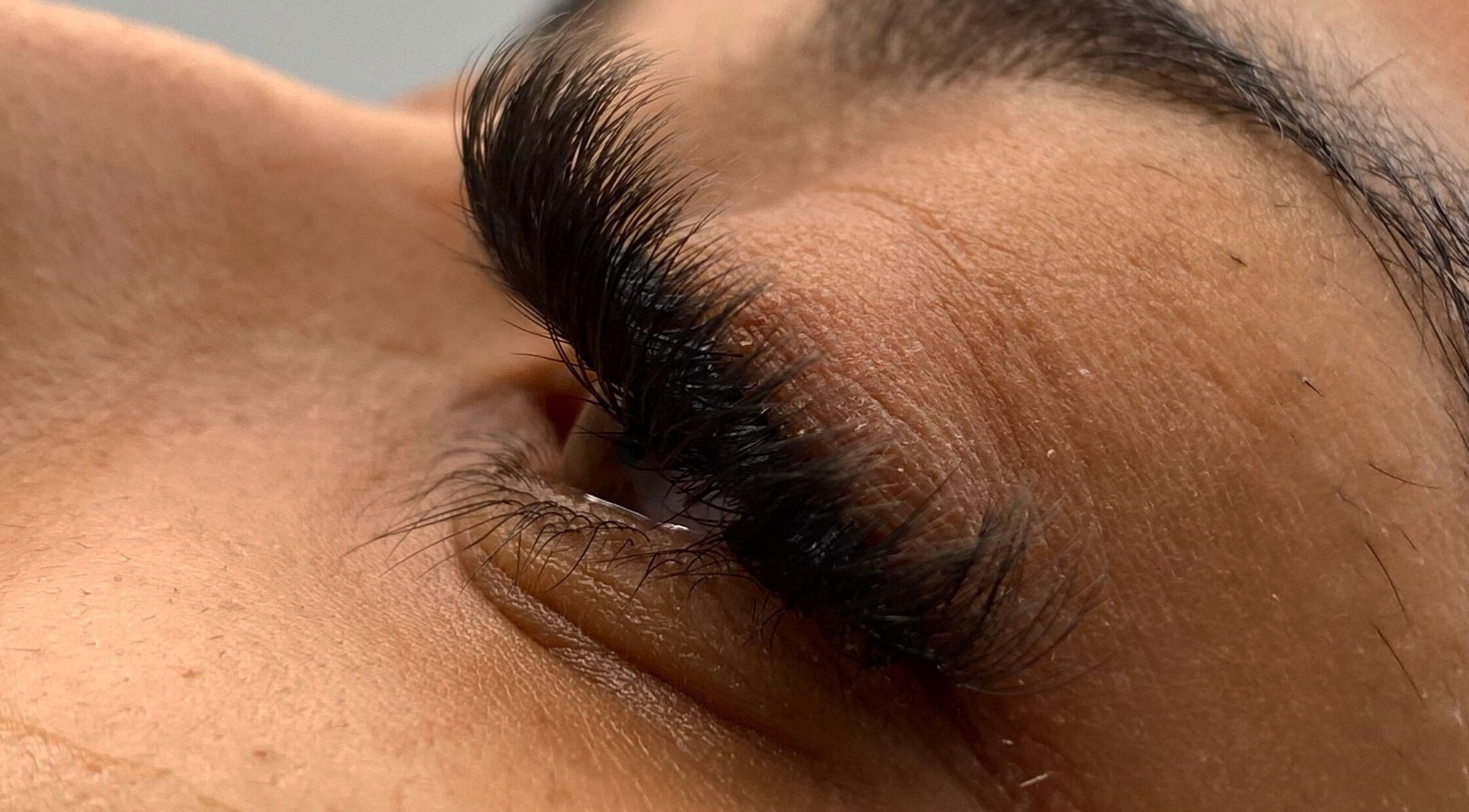 Close-up of eyelash extensions at WellBySyd | Beauty+Body in Sparta, New Jersey, US, showcasing detailed application.