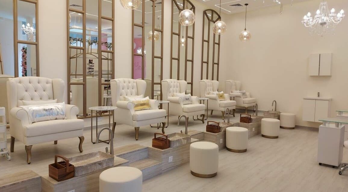 Luxurious pedicure stations at Maison De Coiffure Beauty Lounge, Dubai, AE with elegant chairs and lighting.