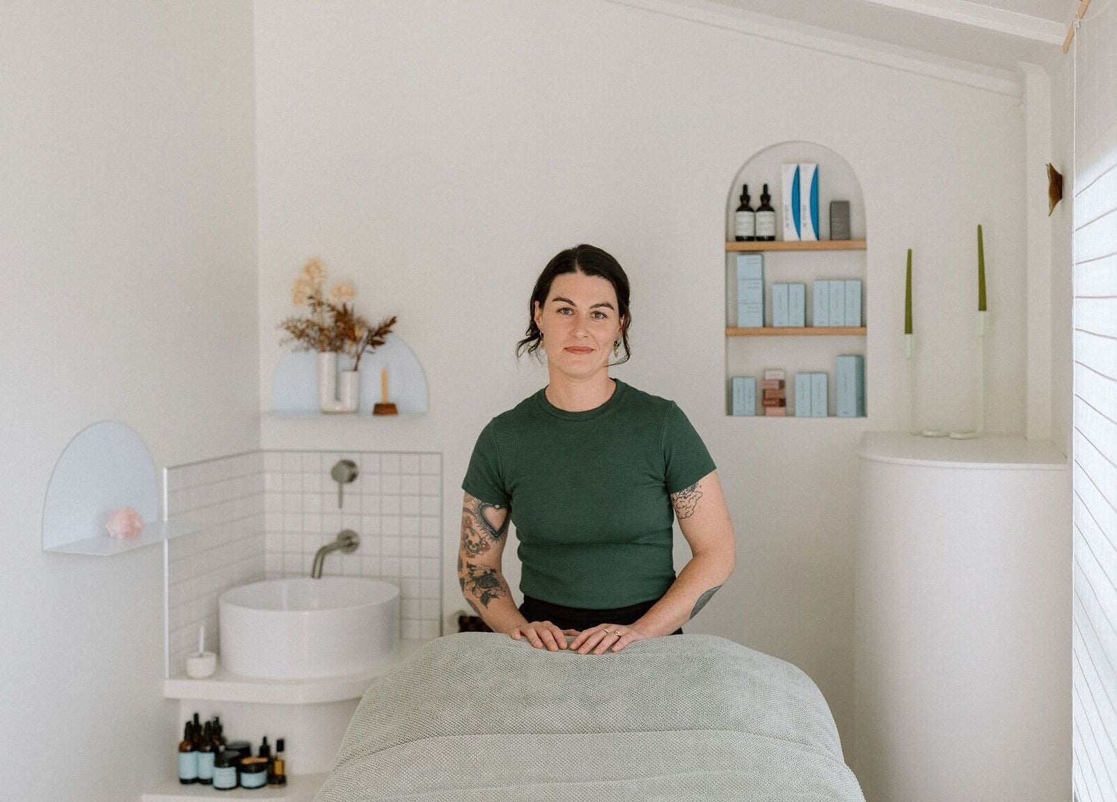 Relaxing therapy room at Innerbloom Holistic Skin Studio, Auckland, NZ featuring serene decor and natural products.