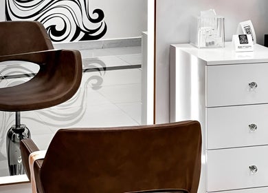 Elegant salon chair and mirror in Beauty Room Salon, Dibba, AE, showcasing stylish interior design.