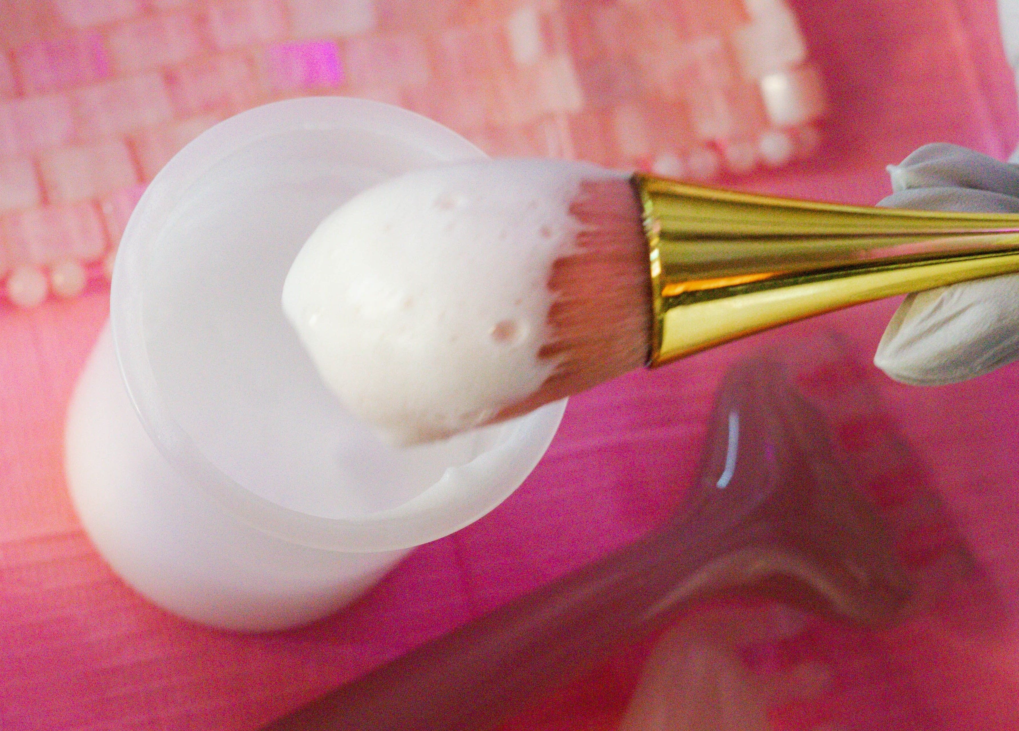 A brush applying foamy product at Angel Aesthetics by Angelina in Biloxi, Mississippi, US.