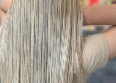 Long, straight, silky blonde hair styled at Simone Hair Artistry, Melbourne, Victoria, AU.
