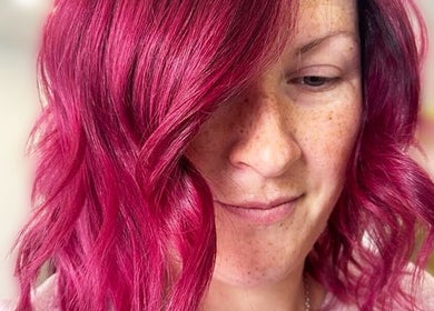 Close-up of vibrant pink wavy hairstyle at Simone Hair Artistry, Melbourne, Victoria, AU.