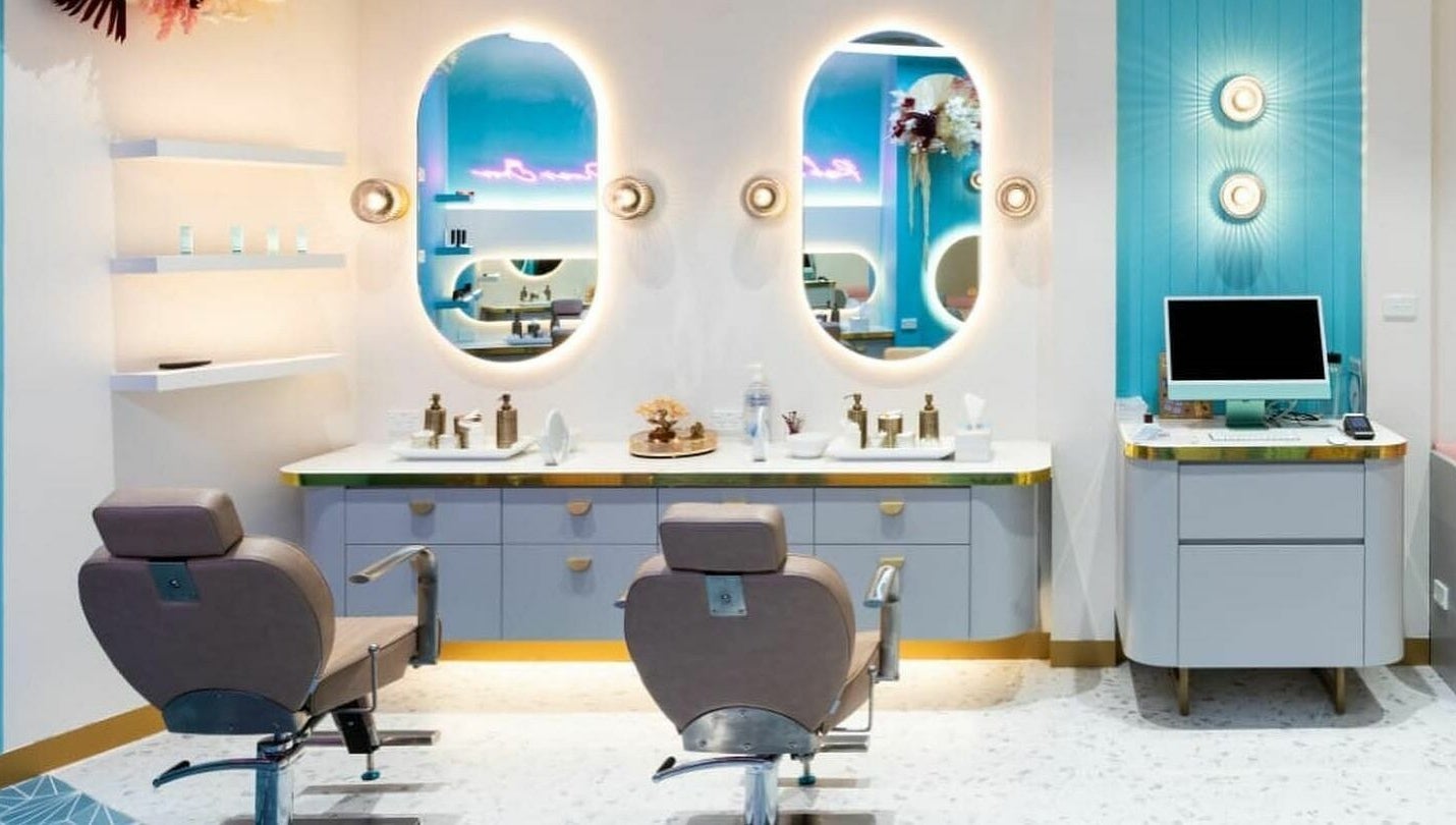 Elegant salon interior at Divas Brow Eastgardens, New South Wales, AU with chic decor and illuminated mirrors.