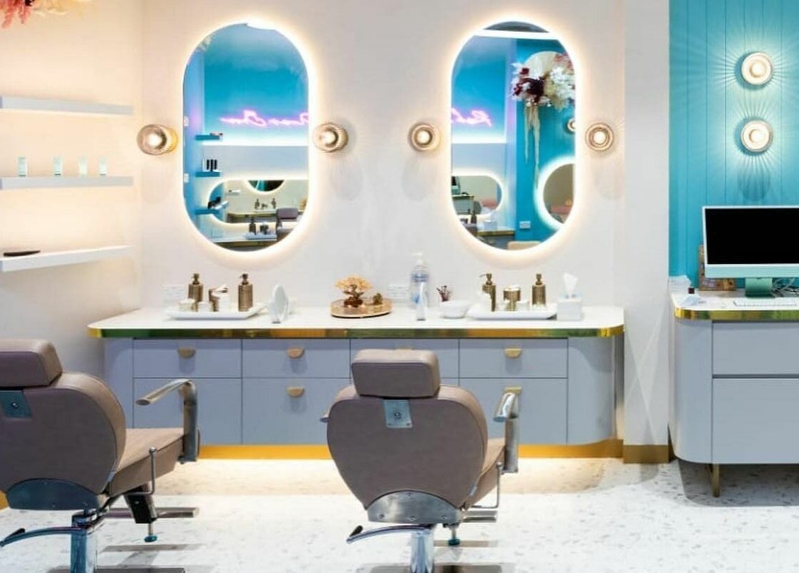 Elegant salon interior at Divas Brow Eastgardens, New South Wales, AU with chic decor and illuminated mirrors.