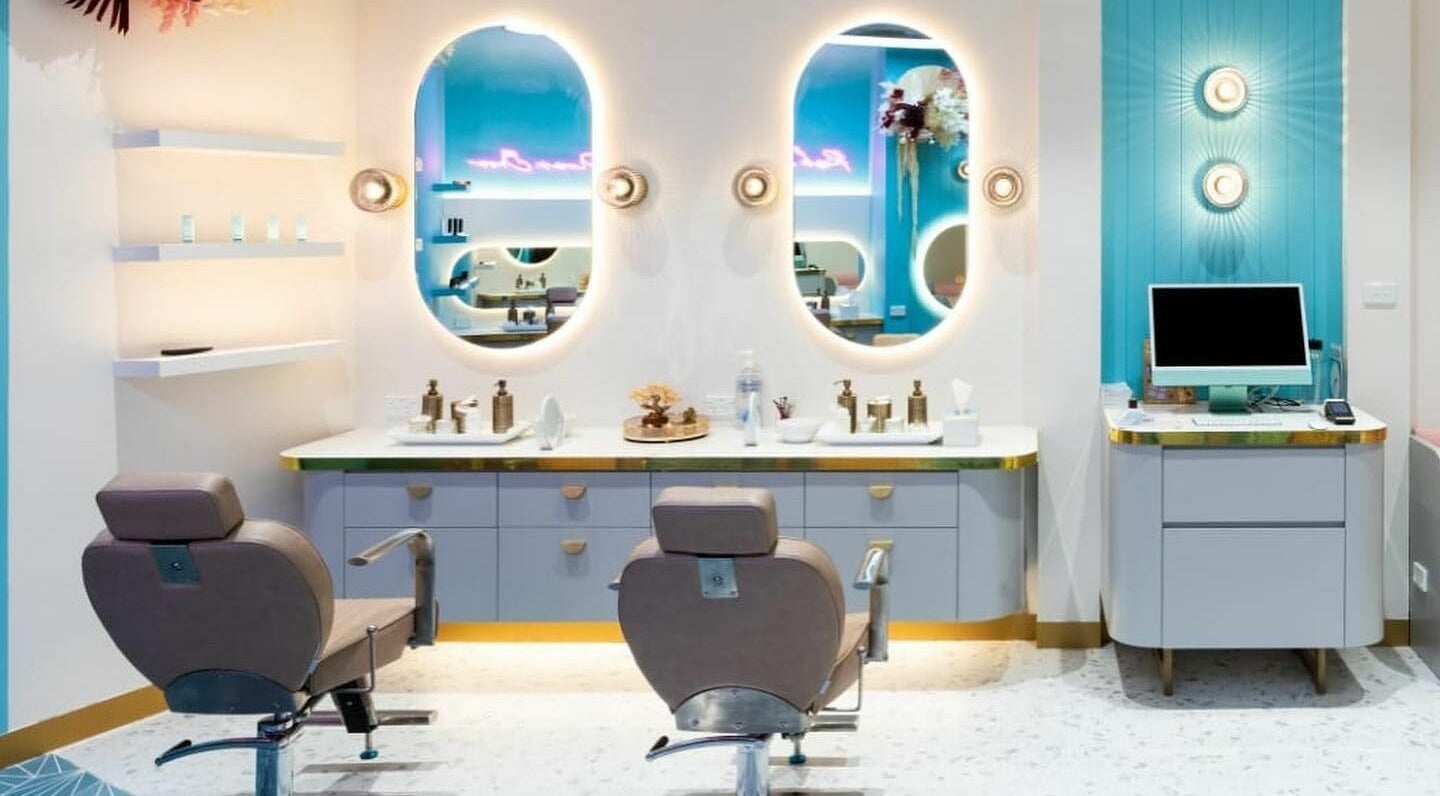 Elegant salon interior at Divas Brow Eastgardens, New South Wales, AU with chic decor and illuminated mirrors.
