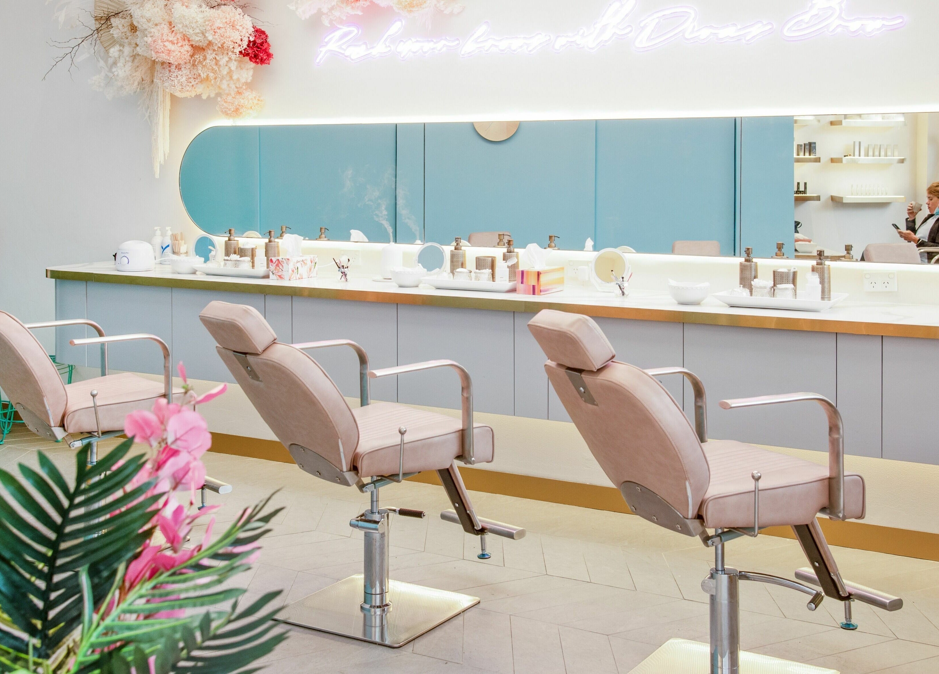 Elegant salon interior at Divas Brow Warringah Mall, Brookvale, New South Wales, AU with chic styling chairs.