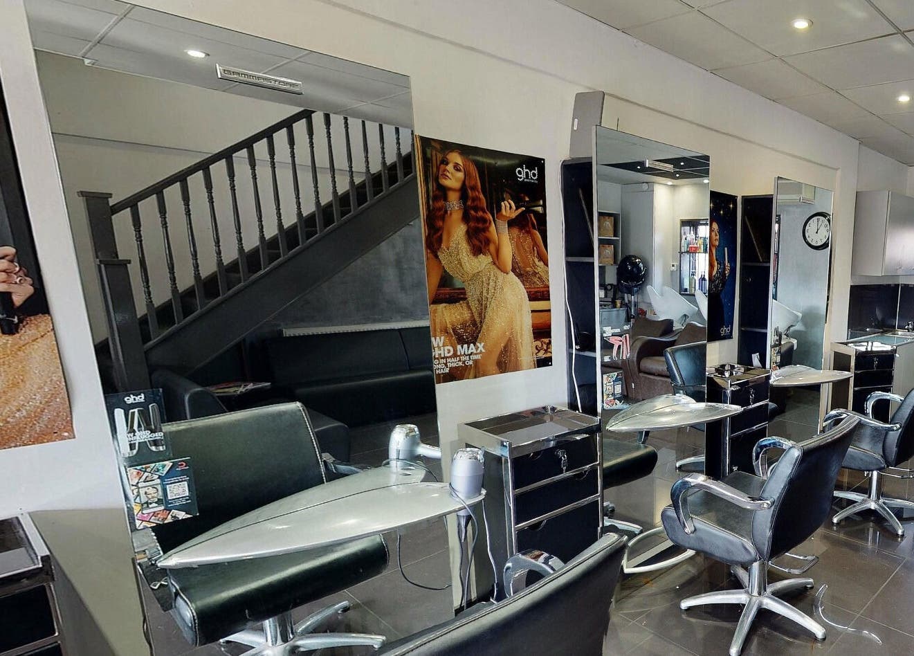 Italian Inspiration salon interior in Woking, England, GB featuring stylish chairs and modern decor.