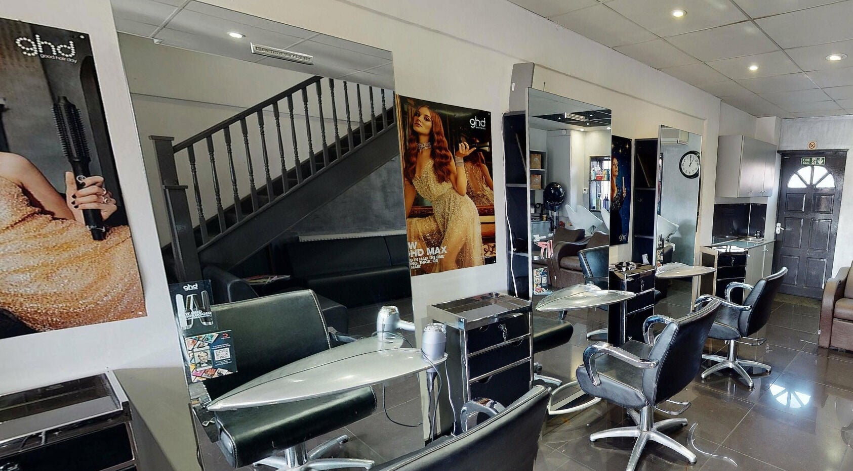 Italian Inspiration salon interior in Woking, England, GB featuring stylish chairs and modern decor.