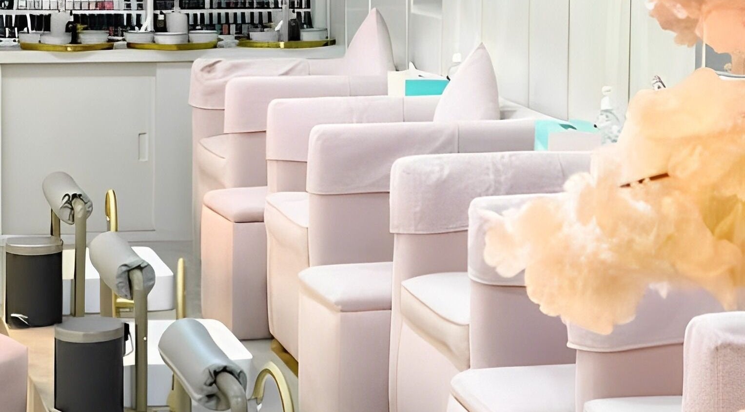 Tranquil nail lounge interior at Stay Flawless Beauty Salon, Dubai, AE, showcasing plush chairs and calming decor.