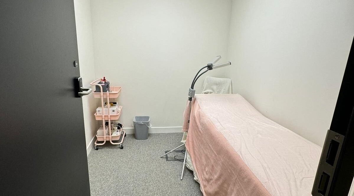 Cozy treatment room at (Closed) Battersea - Wish Beaute in London, England, GB, featuring a pink cover.