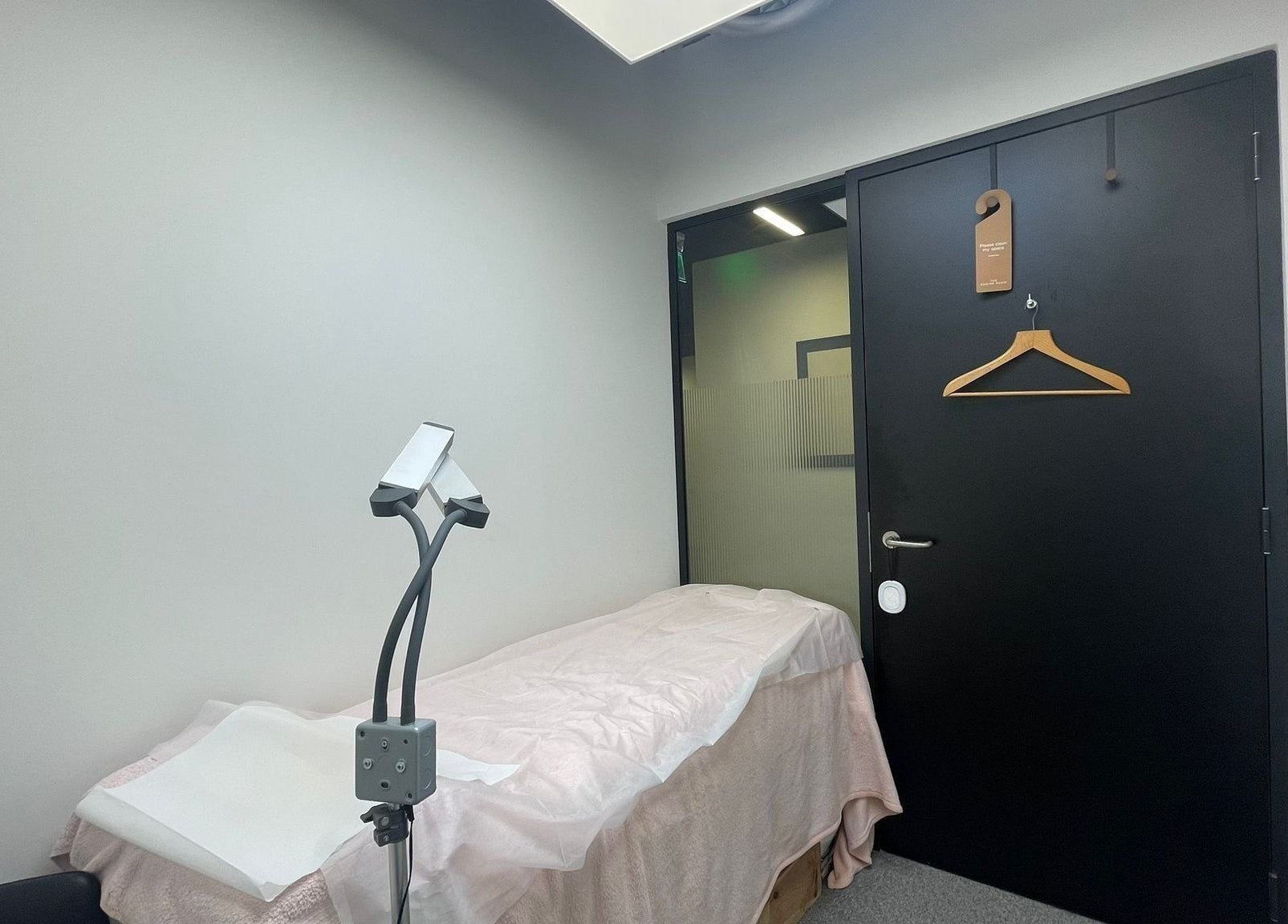 Treatment room at (Closed) Battersea - Wish Beaute, London, England, GB, with bed and equipment.