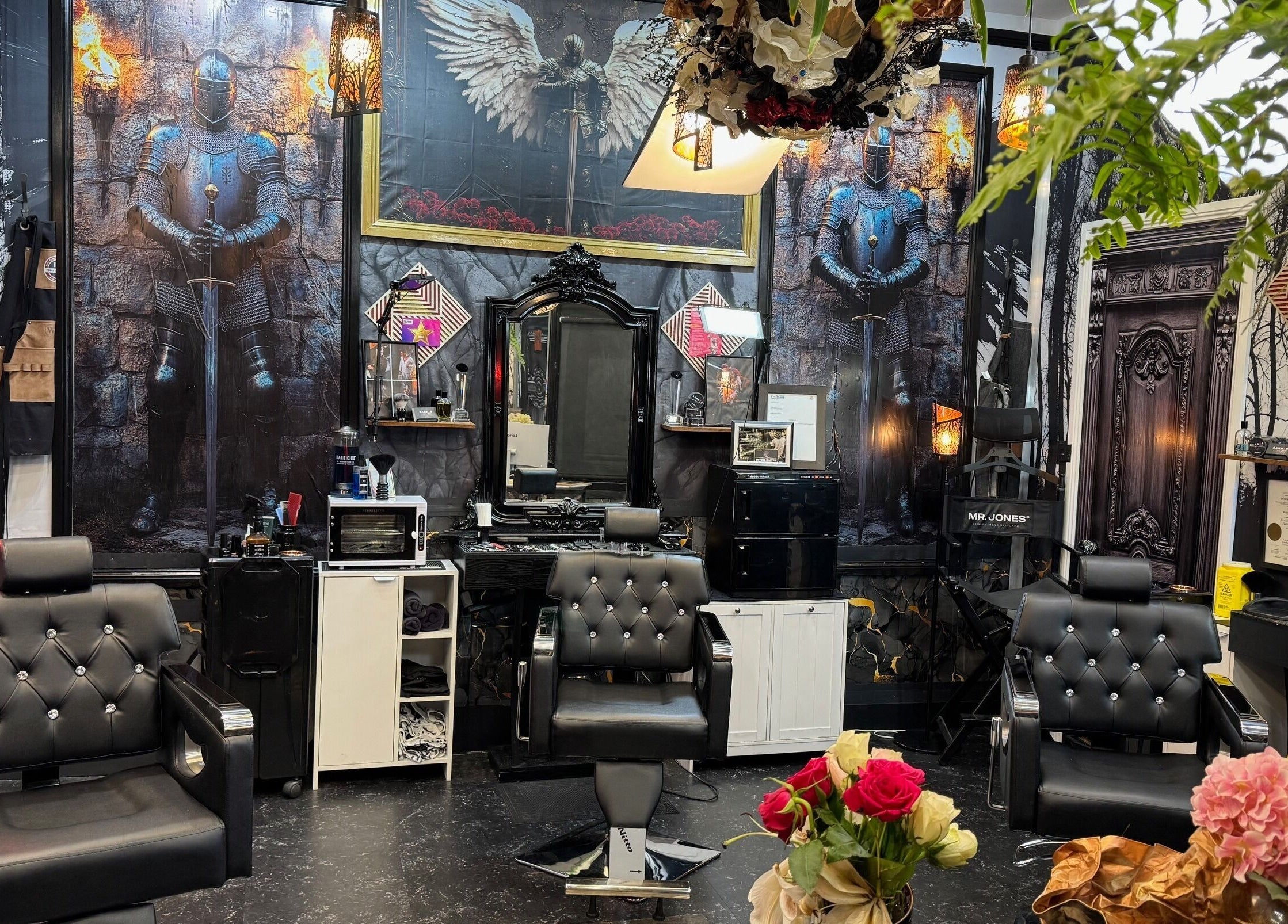 Barber by Design in Deagon, Queensland, AU, featuring knight-themed decor and modern barber chairs.