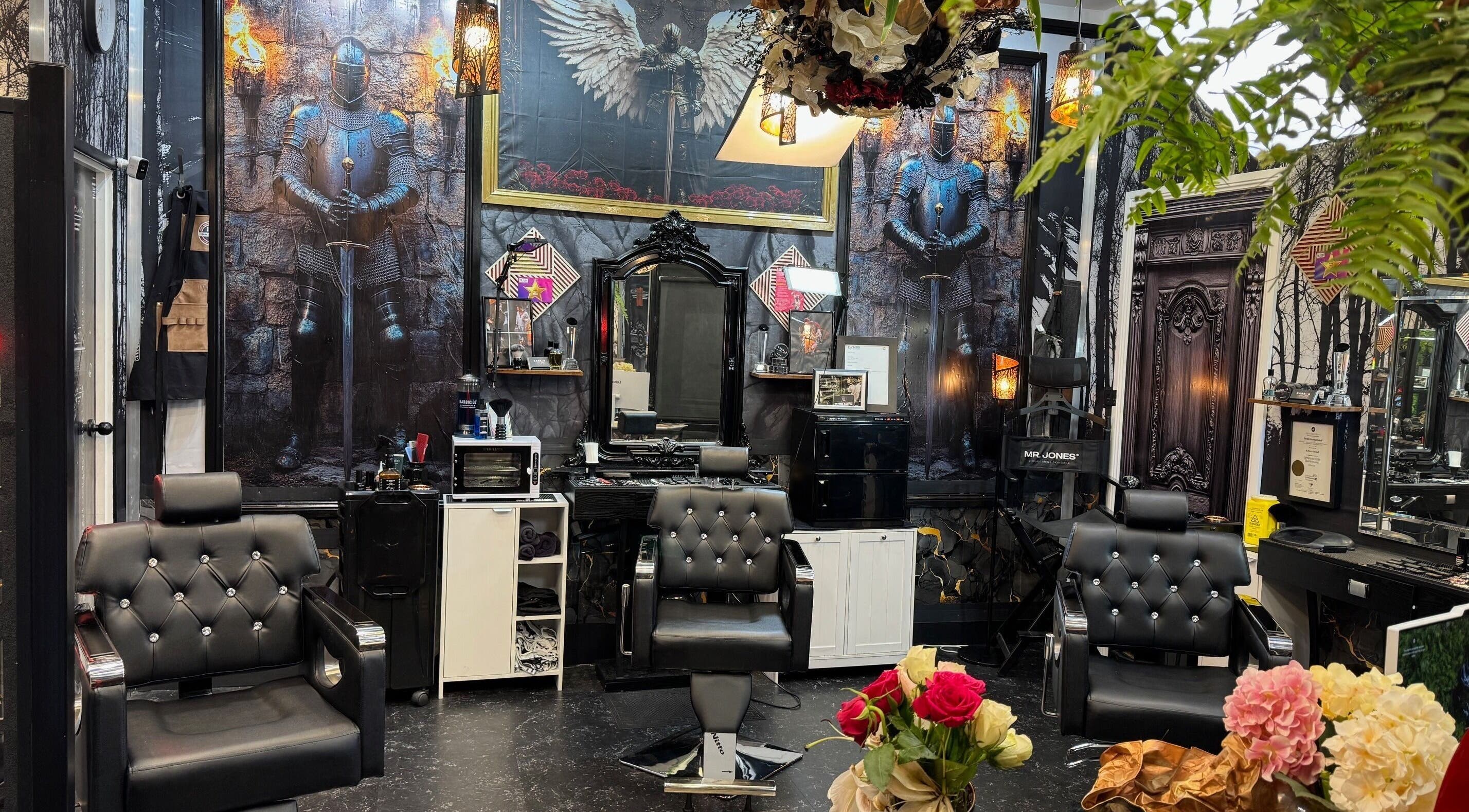 Barber by Design in Deagon, Queensland, AU, featuring knight-themed decor and modern barber chairs.
