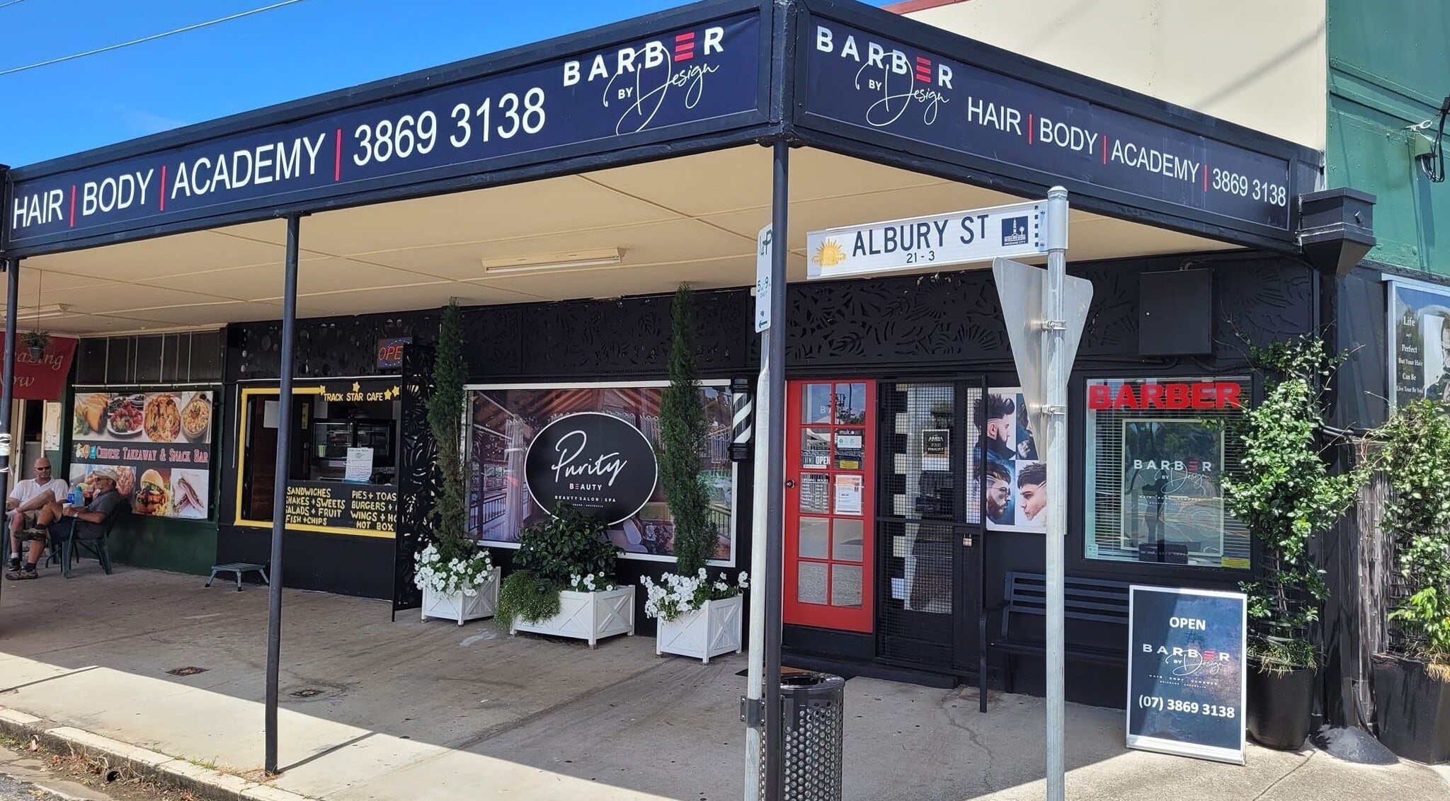 Street view of Barber by Design, Deagon, Queensland, AU showcasing inviting entrance and signage.