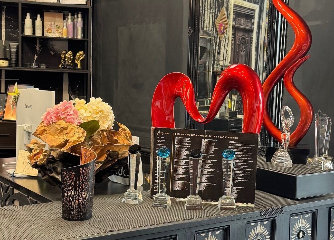 Awards and decor at Barber by Design in Deagon, Queensland, AU showcasing modern style and recognition.