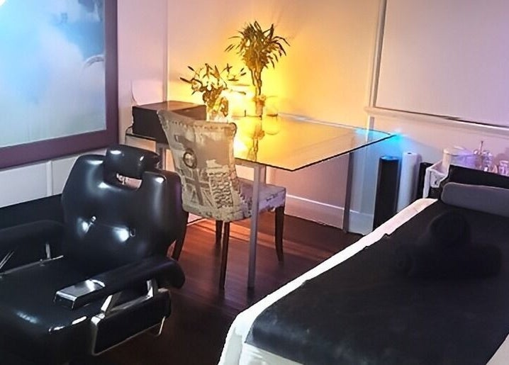 Modern barber seat and spa table at Barber by Design, Deagon, Queensland, AU. Relaxing ambiance.