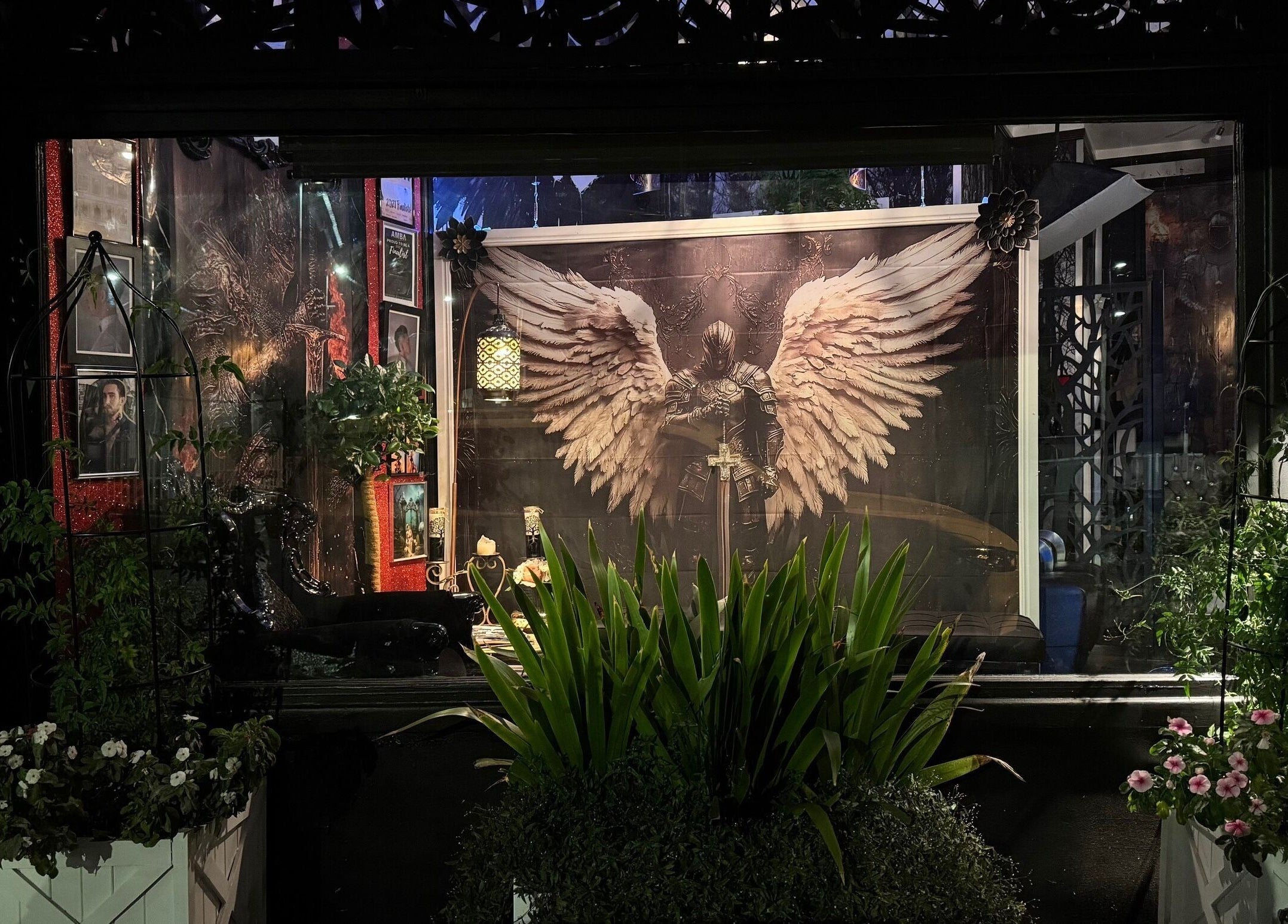 Barber by Design shopfront with angel artwork and lush plants in Deagon, Queensland, AU.