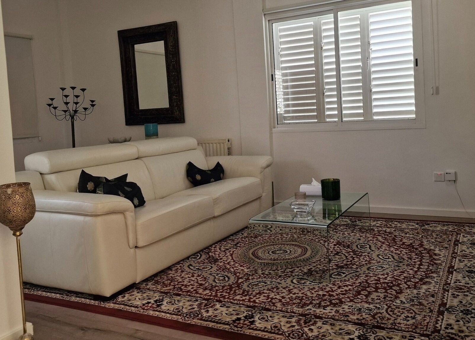 Luxurious lounge area at Salvatore, Germasogeia, Limassol, CY with plush sofa and stylish decor.