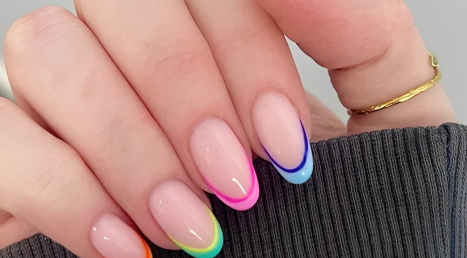 Colorful nail art on display at Wondernails by Jojo, Glasgow, Scotland, GB. Bright, trendy design.