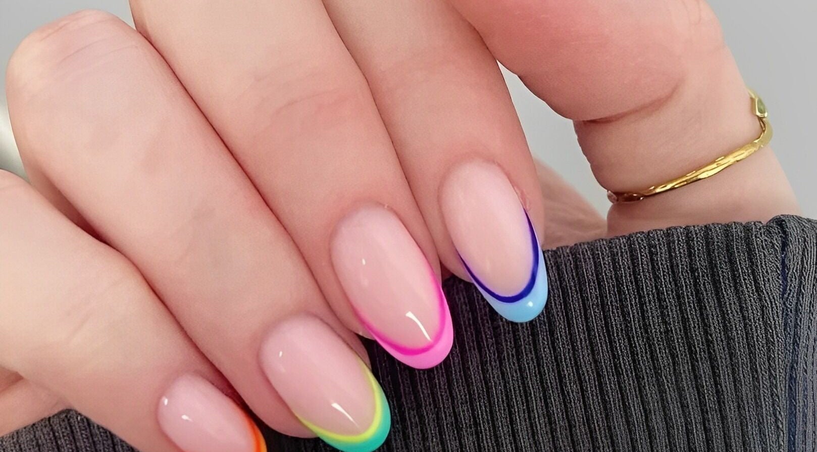 Colorful nail art on display at Wondernails by Jojo, Glasgow, Scotland, GB. Bright, trendy design.