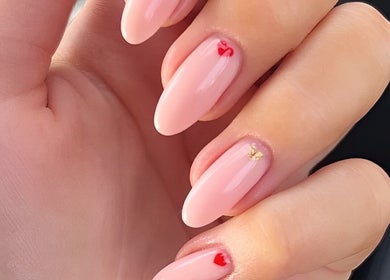 Elegant nail art at Wondernails by Jojo, Glasgow, Scotland, GB. Pink nails with small red and gold details.