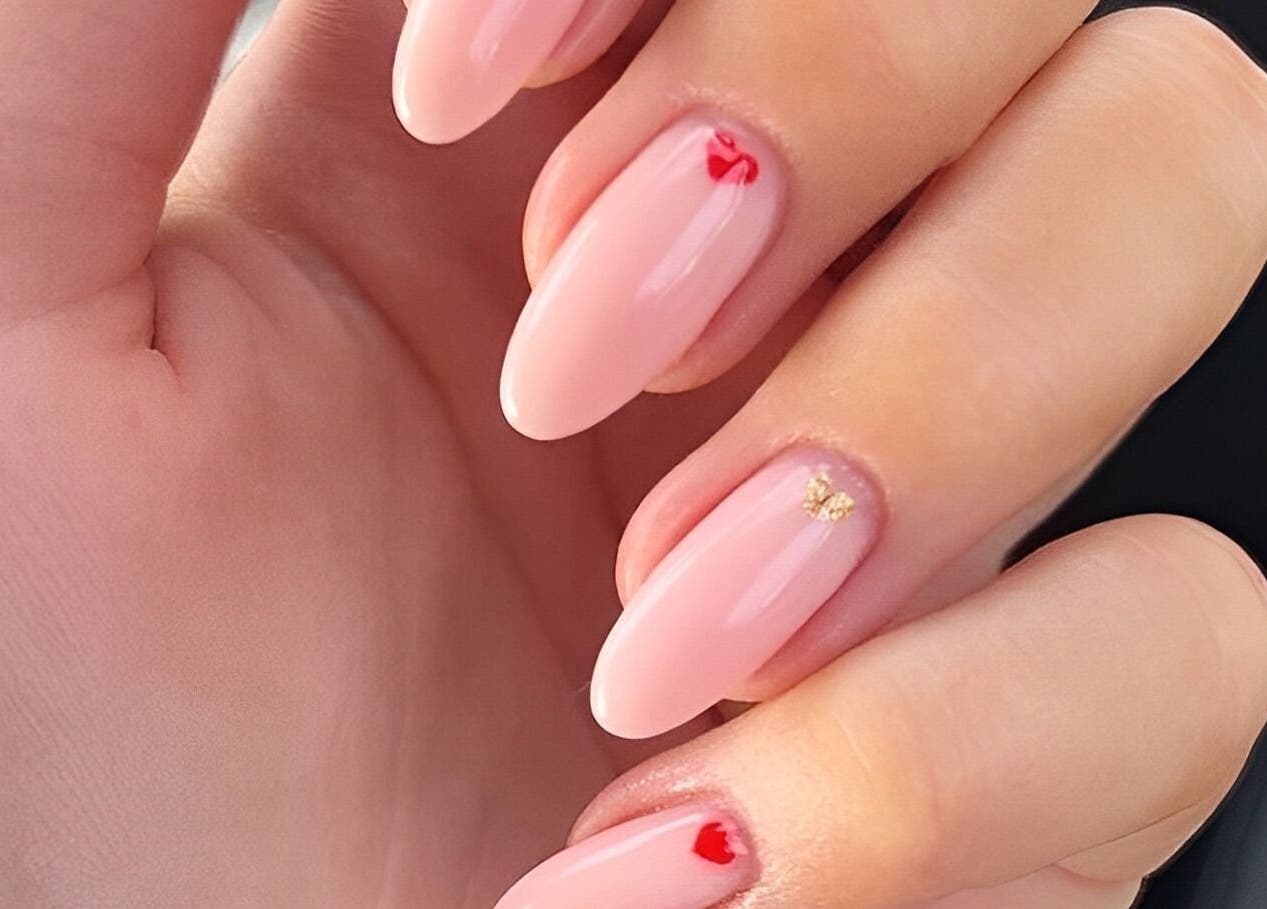Elegant nail art at Wondernails by Jojo, Glasgow, Scotland, GB. Pink nails with small red and gold details.