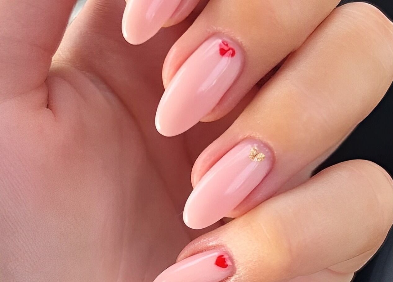 Elegant nail art at Wondernails by Jojo, Glasgow, Scotland, GB. Pink nails with small red and gold details.