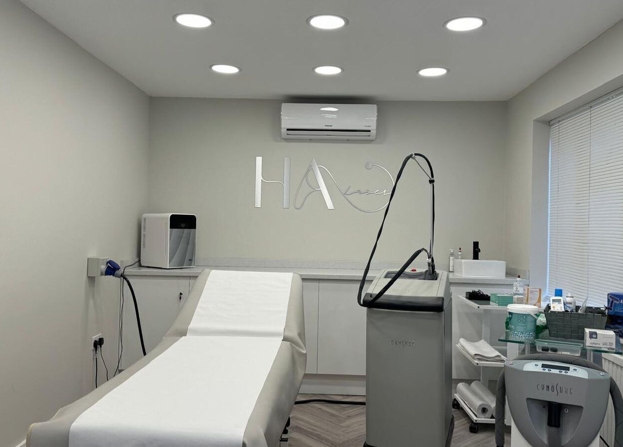 Sleek laser treatment room at HA Laser Studio in Basingstoke, England, GB, equipped with advanced technology.