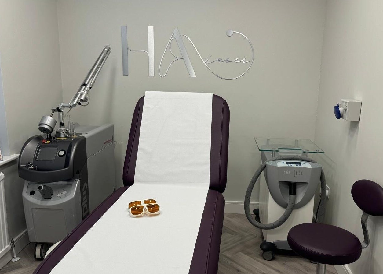 HA Laser Studio treatment room in Basingstoke, England, GB, featuring a modern laser machine and treatment chair.