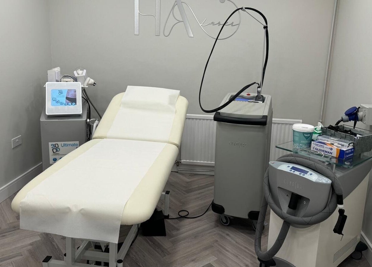 Modern treatment room at HA Laser Studio, Basingstoke, England, GB, showcasing advanced beauty equipment.