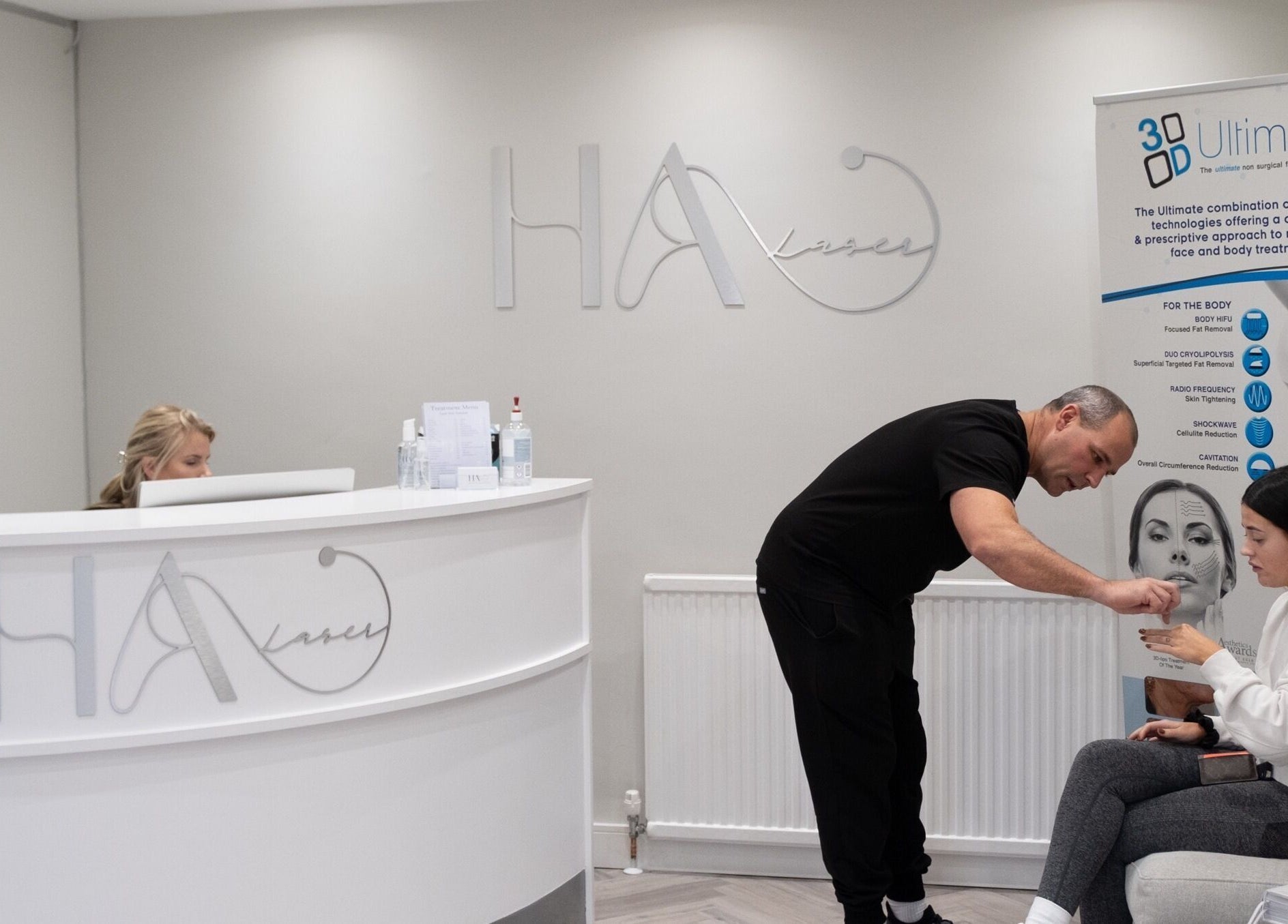 Warm welcome at HA Laser Studio reception in Basingstoke, England, GB with customer interaction.