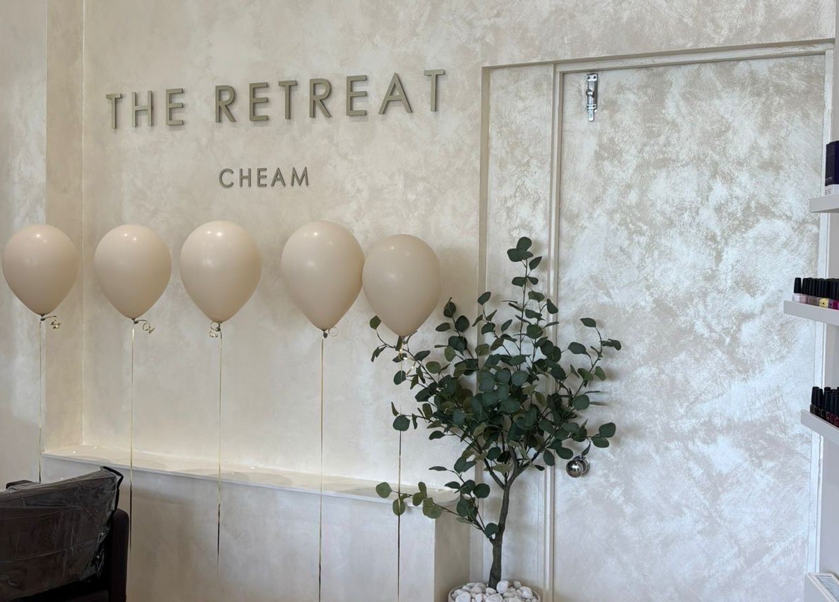 Interior view of The Retreat in Sutton, England, GB, featuring balloons and elegant decor.