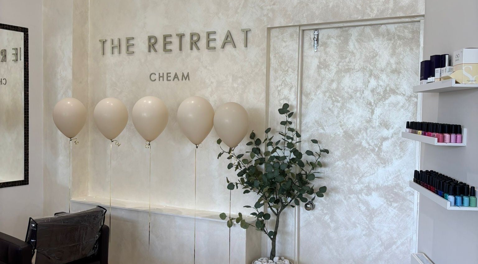 Interior view of The Retreat in Sutton, England, GB, featuring balloons and elegant decor.