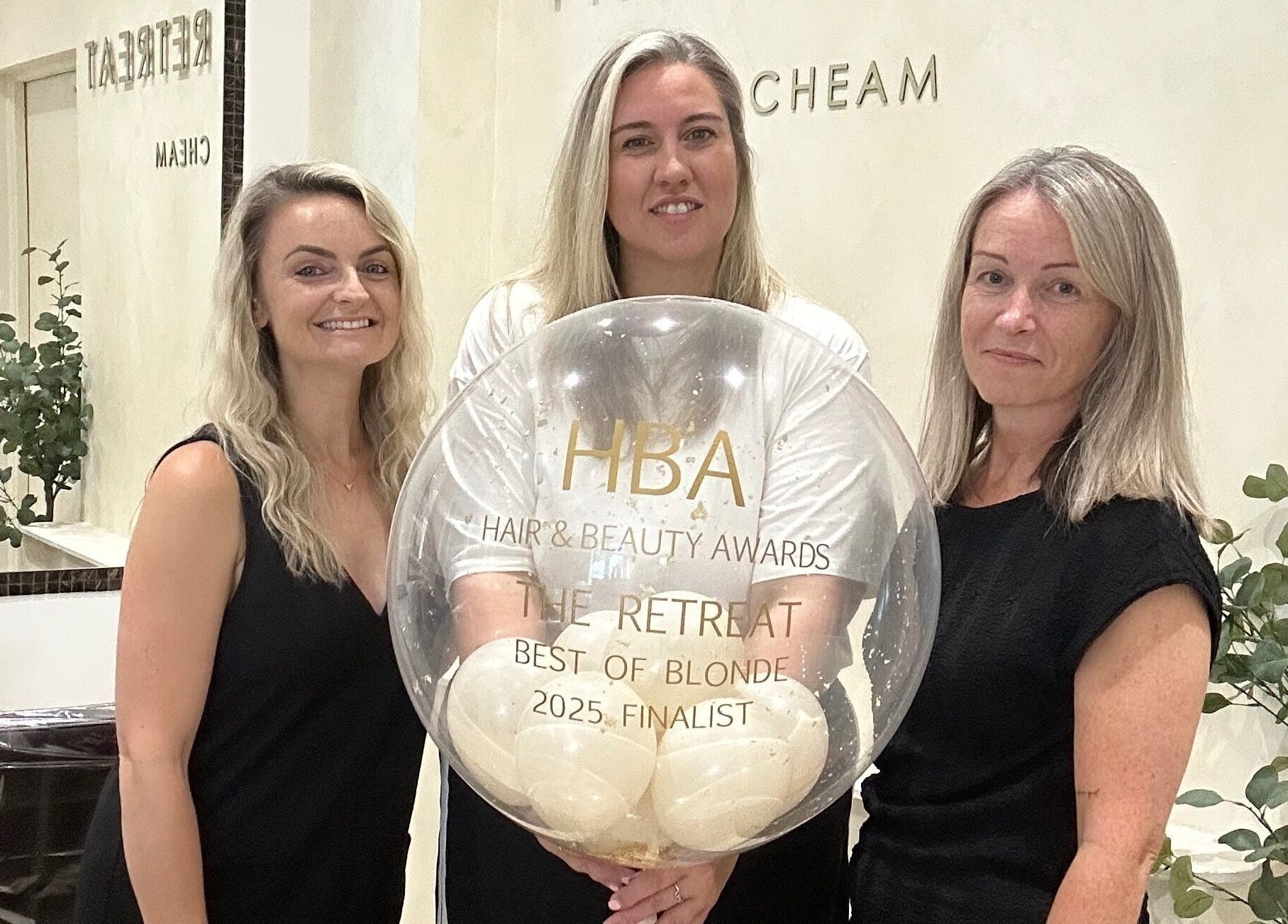 Team at The Retreat in Sutton, England, celebrate their Hair & Beauty Awards finalist honor.