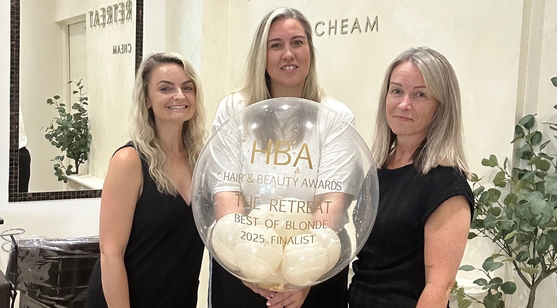 Team at The Retreat in Sutton, England, celebrate their Hair & Beauty Awards finalist honor.