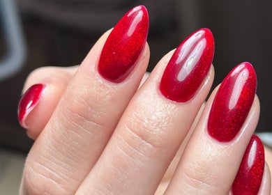 Close-up of vibrant red nails by Lauren Danielle Nail Artist in Andover, England, GB.