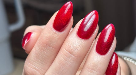 Close-up of vibrant red nails by Lauren Danielle Nail Artist in Andover, England, GB.