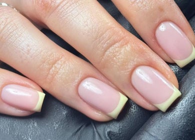 Elegant French manicure by Lauren Danielle Nail Artist in Andover, England, GB, showcasing classy nail art.