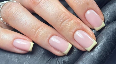 Elegant French manicure by Lauren Danielle Nail Artist in Andover, England, GB, showcasing classy nail art.