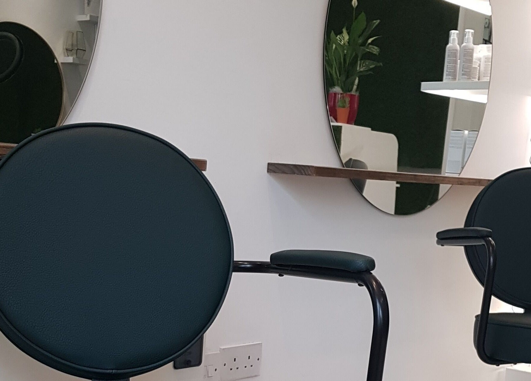 Stylish salon interior at Martinas Hair Design, Clonakilty, County Cork, IE, featuring modern styling chairs and mirrors.