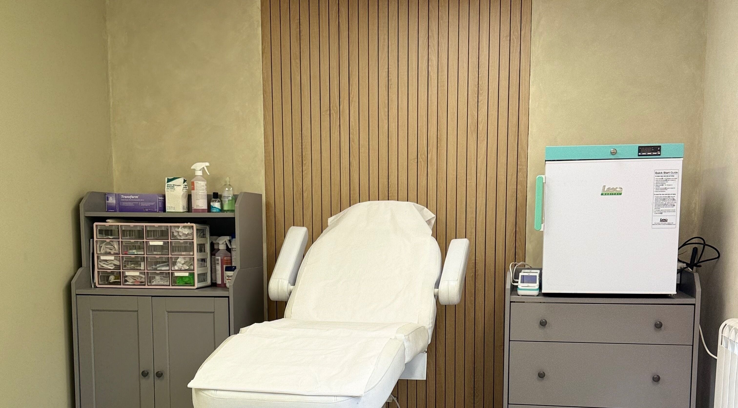 Tranquil treatment room at Karen Brereton Aesthetics, Loughborough, England, GB equipped with a plush treatment chair.