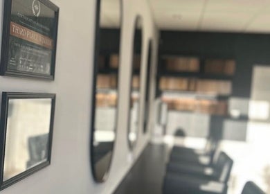 Elegant interior of Jemma Louise Hair Extensions, Grantham, England, GB, featuring stylish mirrors.